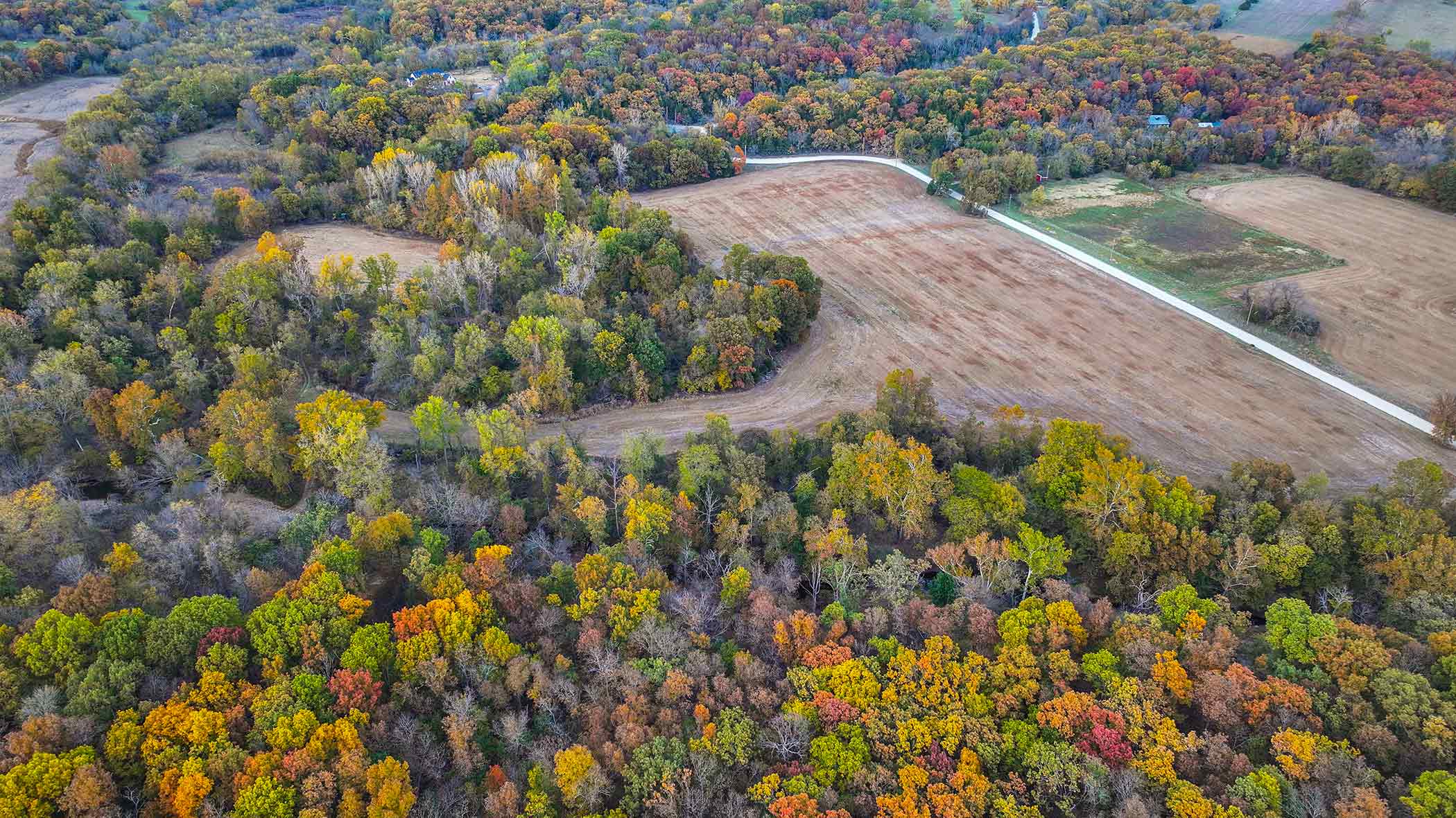Aerial autumn foliage over Red Bird Ranch — the protected land viewed from above