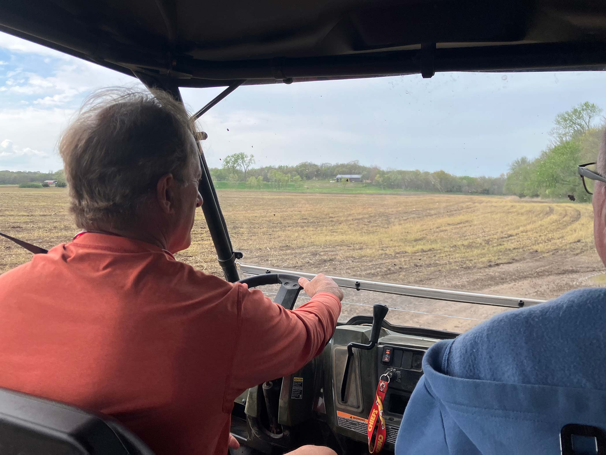 ATV ride across plowed farmland — rider's point of view